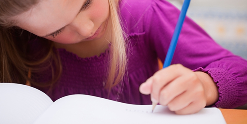 Tween Writing Contest a photo of a girl writing on a notebook