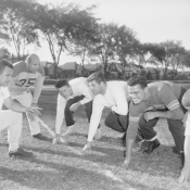 photo of men in football stances 