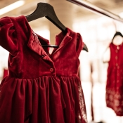 Small red dress hanging. 