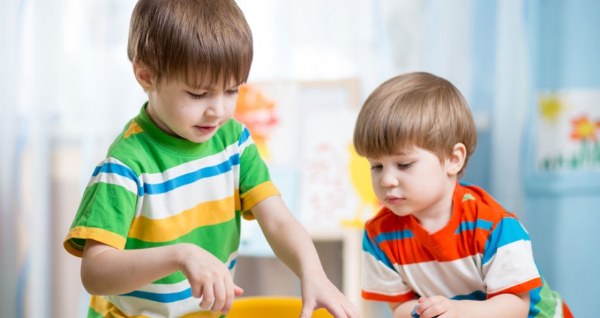 Imagination Stations two boys playing at a table