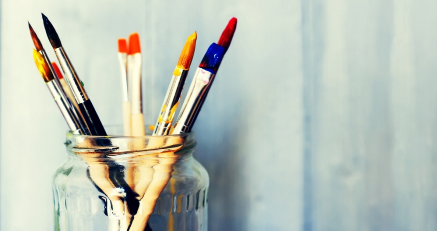 Paintbrushes in a jar